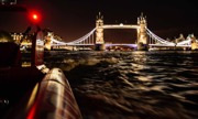 Thames Rocket boat sailing in front of London skyline